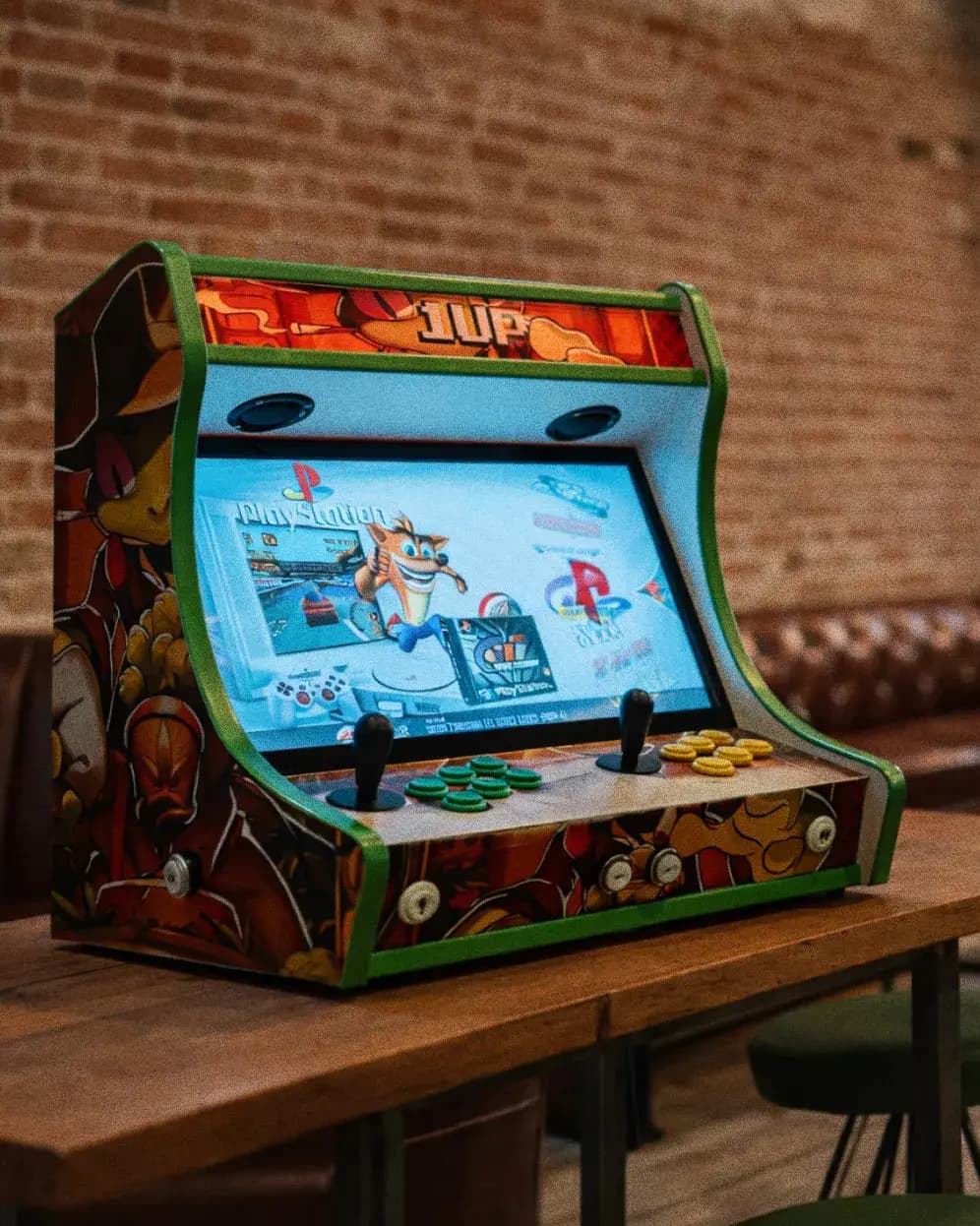 Custom retro arcade machine with ONEUP branding displayed on a wooden table inside the club lounge in Barcelona.