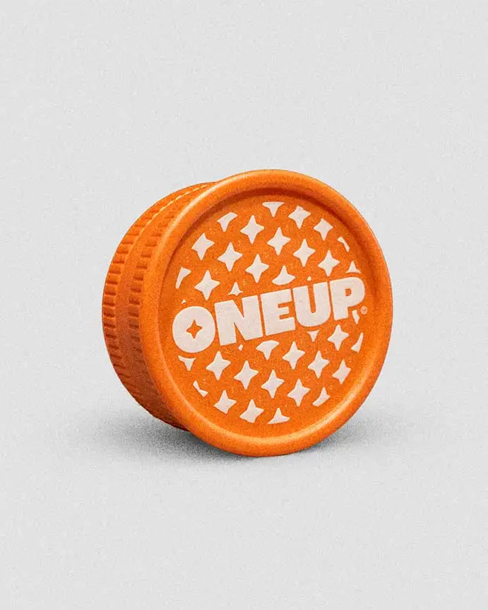 1UP branded grinder — Barcelona cannabis social club accessory